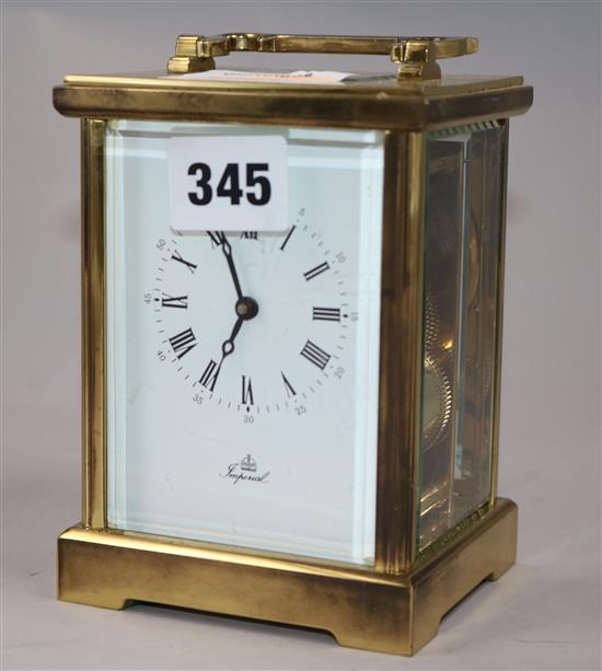 An Imperial brass carriage clock 14cm.